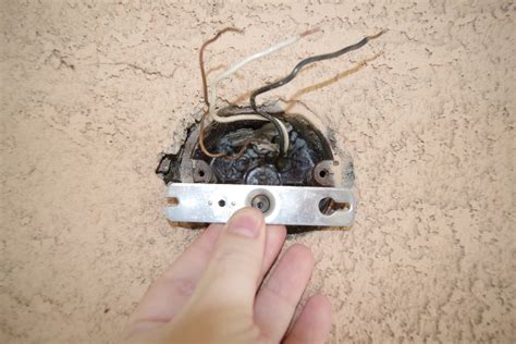 screws not going into junction box|stripped hole in junction box.